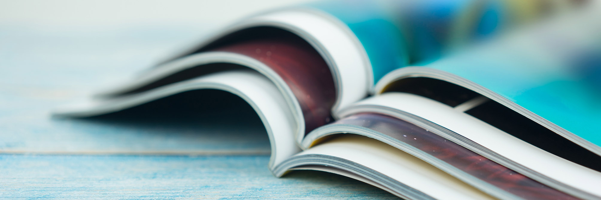 Stack magazines on wooden table