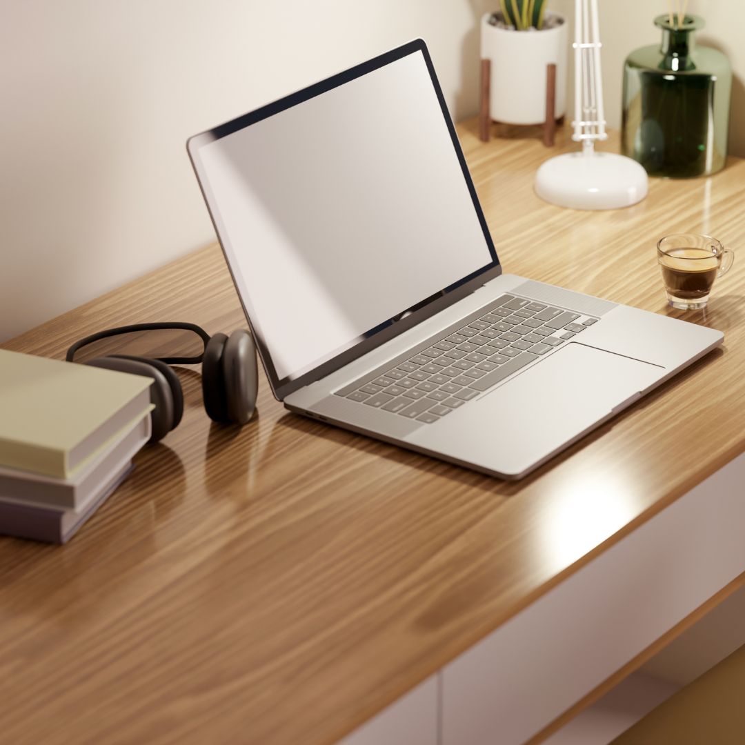 desk with office supplies and laptop